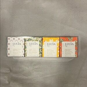 New in box Lucia Soy Mini Candles - Set of 4
